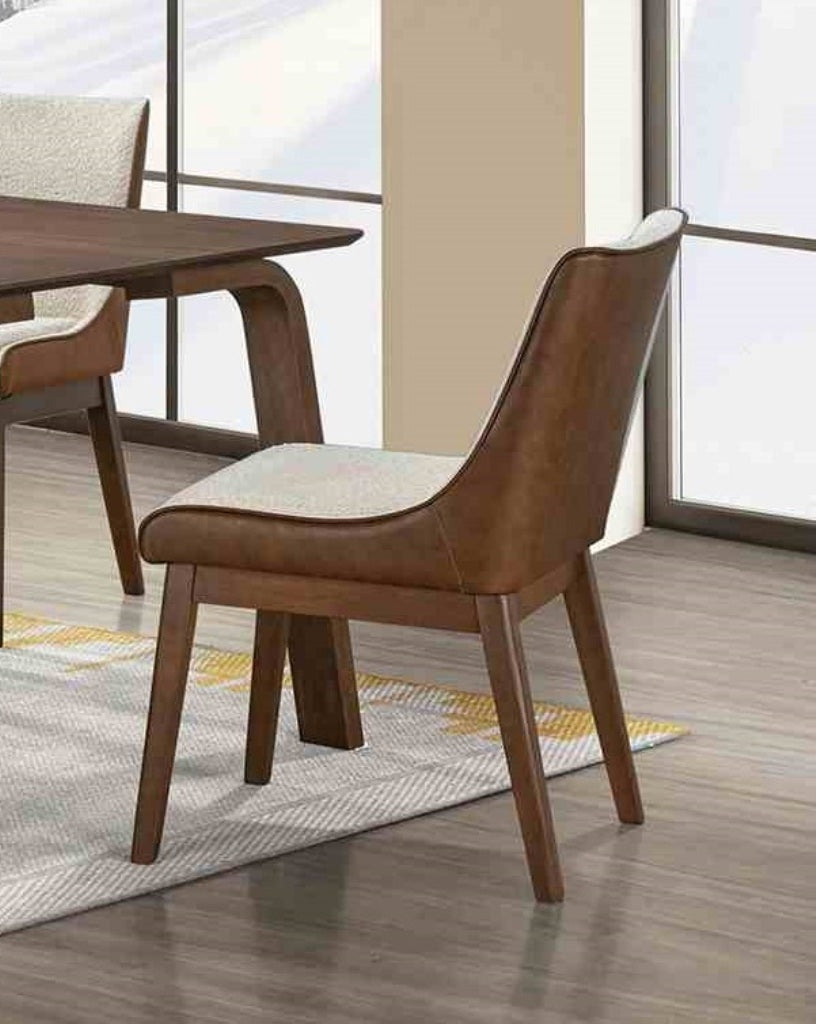 Mid-Century Modern Side Chair in dining setting, featuring padded seat and back with walnut wood frame for a cozy, stylish look.
