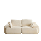 Modern beige two-seater sectional sofa in textured corduroy fabric with extra deep, plush cushions.