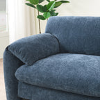 Detailed view of plush armrest and cushion on modular sofa, showcasing comfort and high-quality fabric texture.