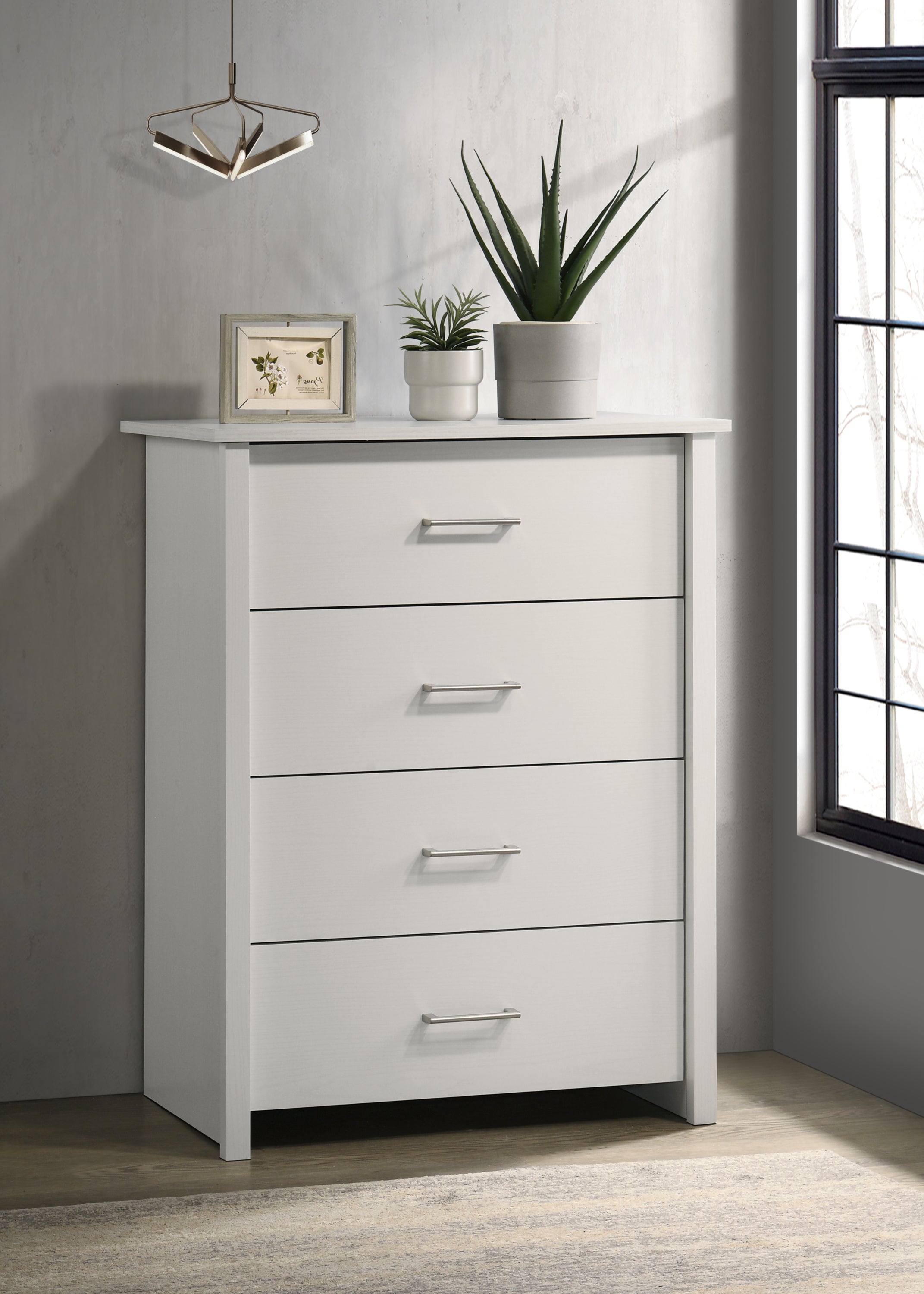 Celeste Chest - White 4-Drawer Chest with silver handles in modern room setting. Smooth-glide drawers offer sleek, versatile storage.