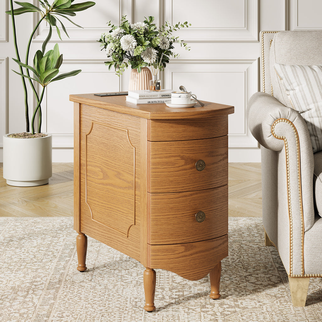 Narrow oak-toned end table with two curved drawers, vintage style, integrated charging station, and solid wood legs.