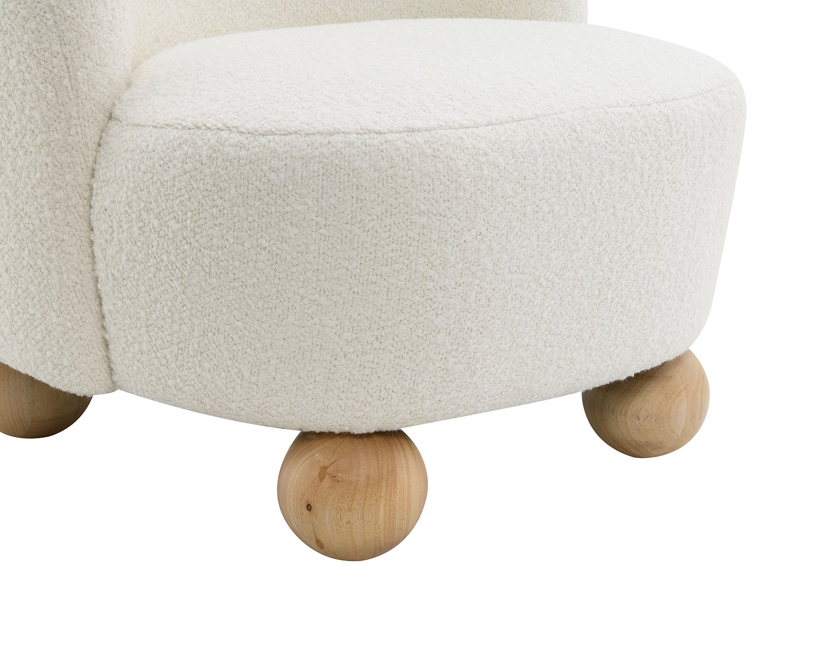 Close-up of Boucle Upholstered Accent Chair's rounded wooden ball feet and thick cushioned seat in soft boucle fabric.