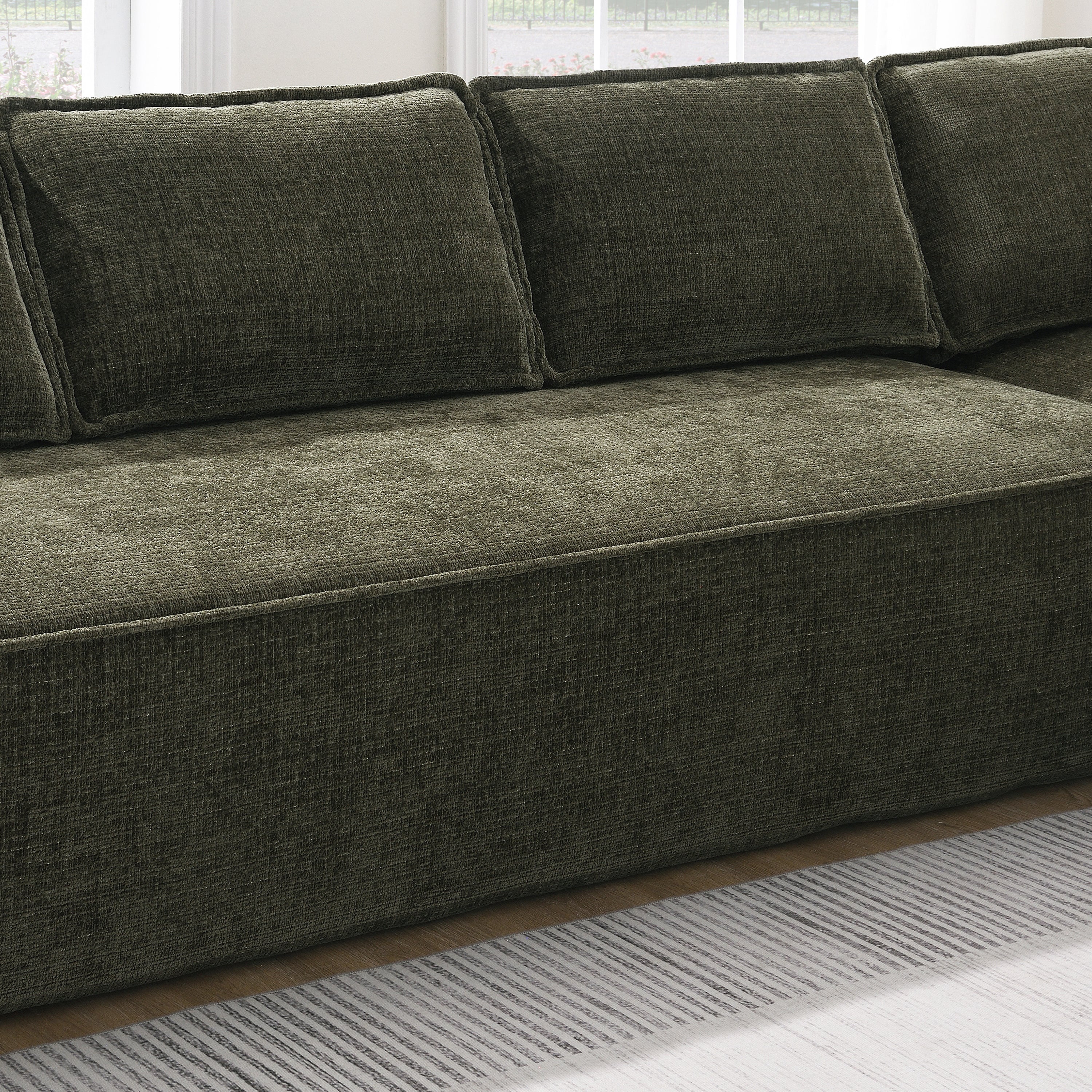 Close-up of chenille fabric and cushion detail on the Modular Sectional Sofa, highlighting its wrinkle-resistant texture and plush comfort.