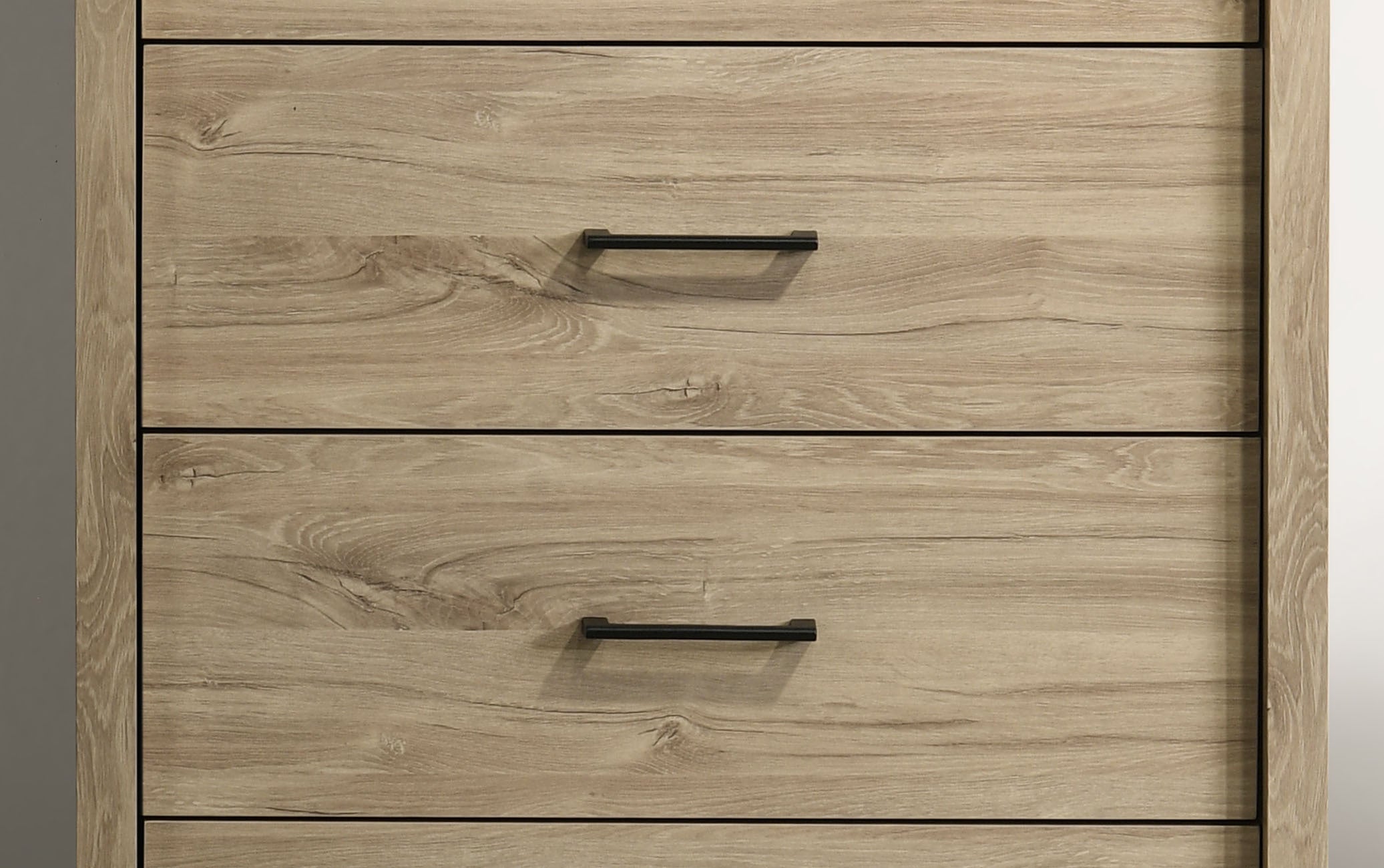 Middle drawers of Light Oak 4-Drawer Chest with Black Handles showcasing wood grain pattern and minimalist hardware.