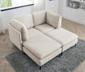 Modern beige linen modular sectional sofa with plush cushions and slim black metal legs on a grey shag rug.