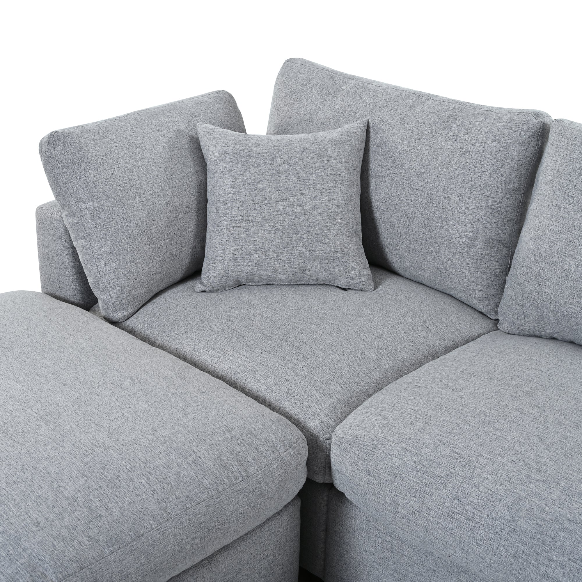 Close-up of center corner seat on 130' U-Shaped Sectional Sofa with accent pillow, highlighting deep seating and soft chenille fabric.