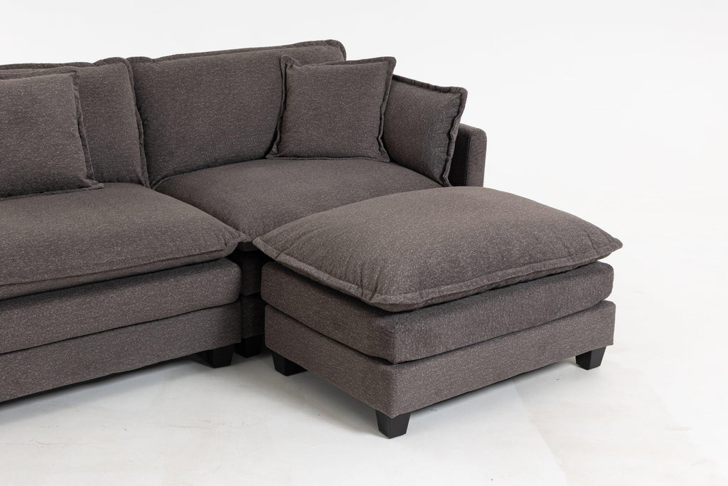 Close-up of Ottoman and corner of Sectional Sofa. Thick cushion and soft chenille upholstery highlight comfort and durability.
