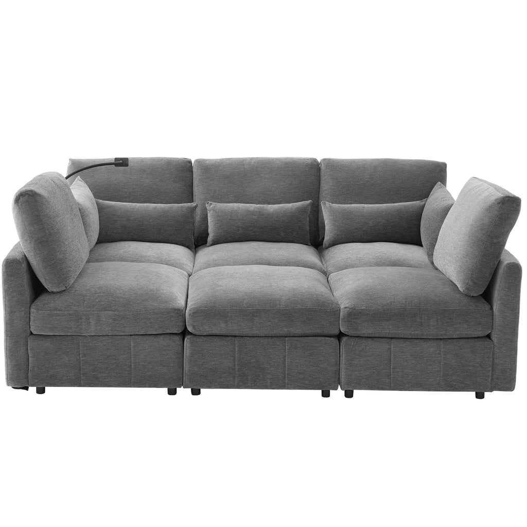 Modern grey chenille modular sectional sofa with plush cushions, built-in USB charging ports, and integrated lamp.