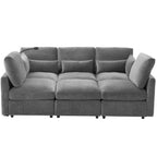 Modern grey chenille modular sectional sofa with plush cushions, built-in USB charging ports, and integrated lamp.