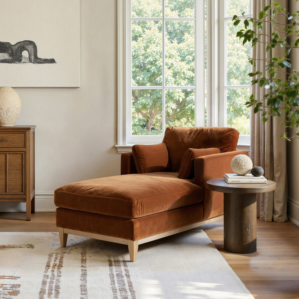 Knox 65' burnt orange velvet chaise lounge chair in a modern farmhouse interior with wood furniture and natural light, perfect for relaxation.