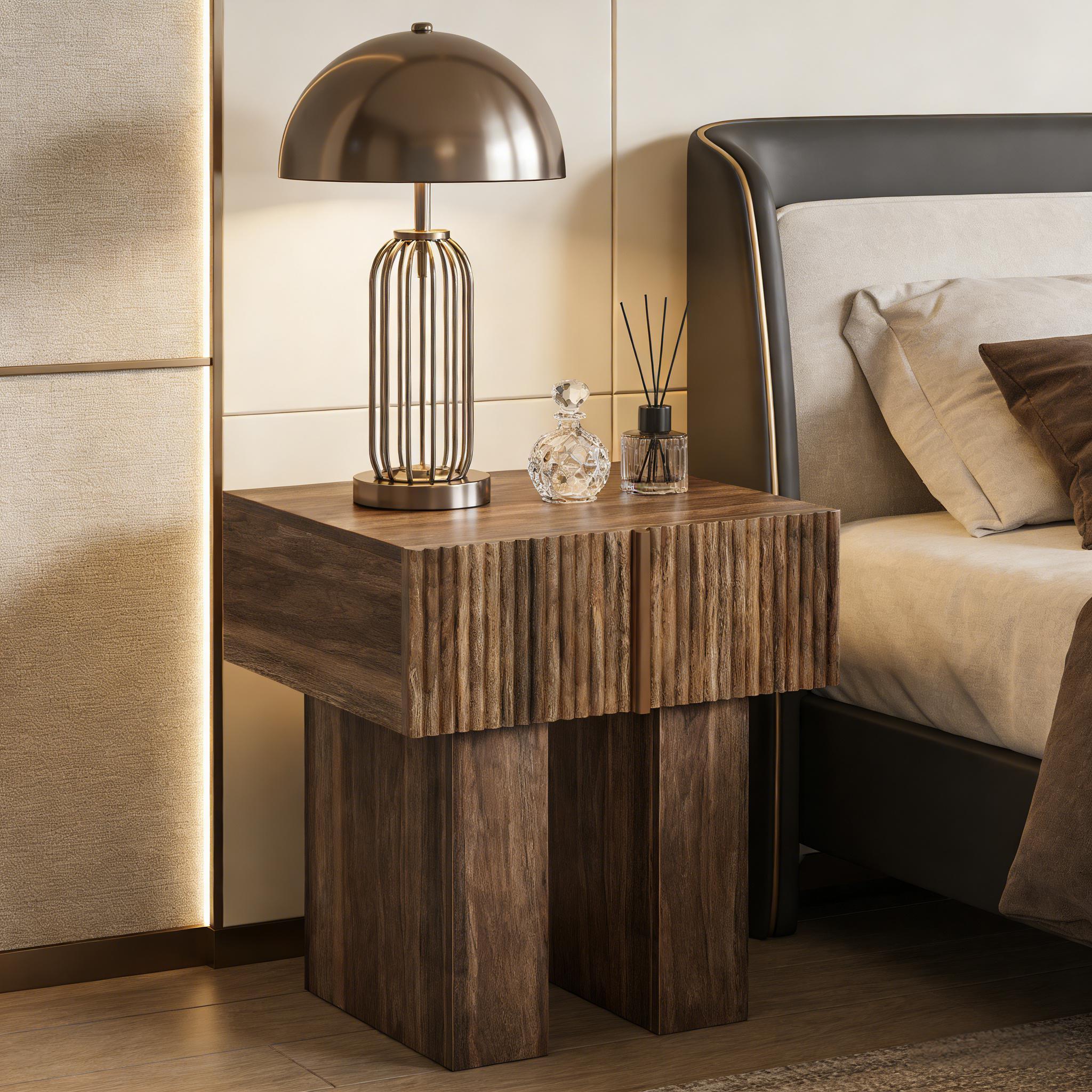 Modern walnut nightstand with a fluted drawer front and sturdy block legs, placed in a contemporary bedroom setting.
