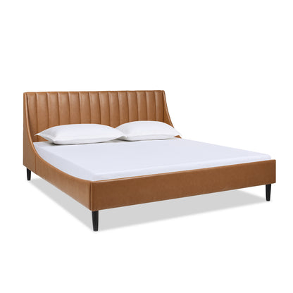 Aspen king platform bed with caramel tan faux leather and vertical tufted headboard, shown with mattress and no bedding.