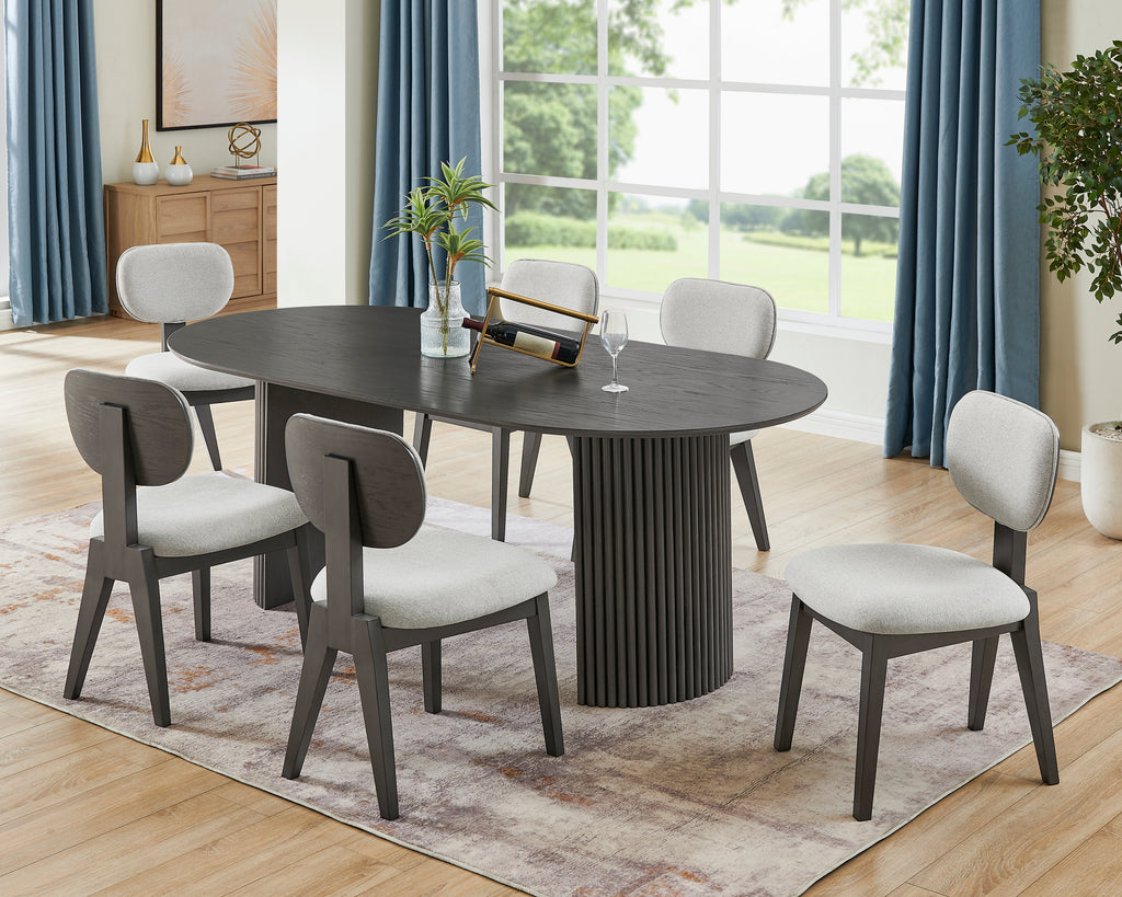 Valencia 7-piece oval gray oak dining set with dual pedestal base and six light gray upholstered chairs in a modern dining room.
