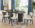 Valencia 7-piece oval gray oak dining set with dual pedestal base and six light gray upholstered chairs in a modern dining room.