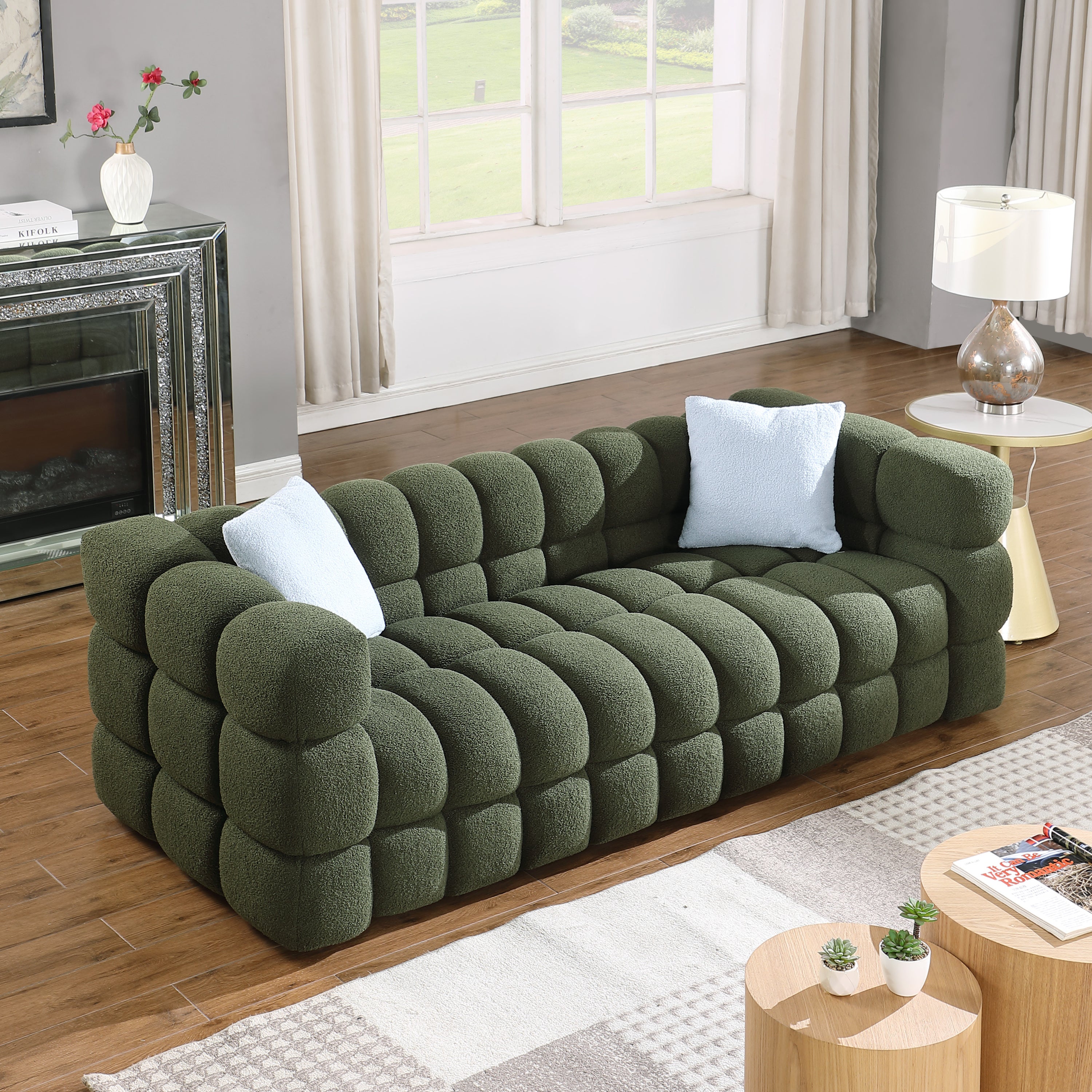 Olive Green Boucle Sofa - 3 Seater, Marshmallow Cozy with plush texture and light blue pillows, angled view in stylish interior.