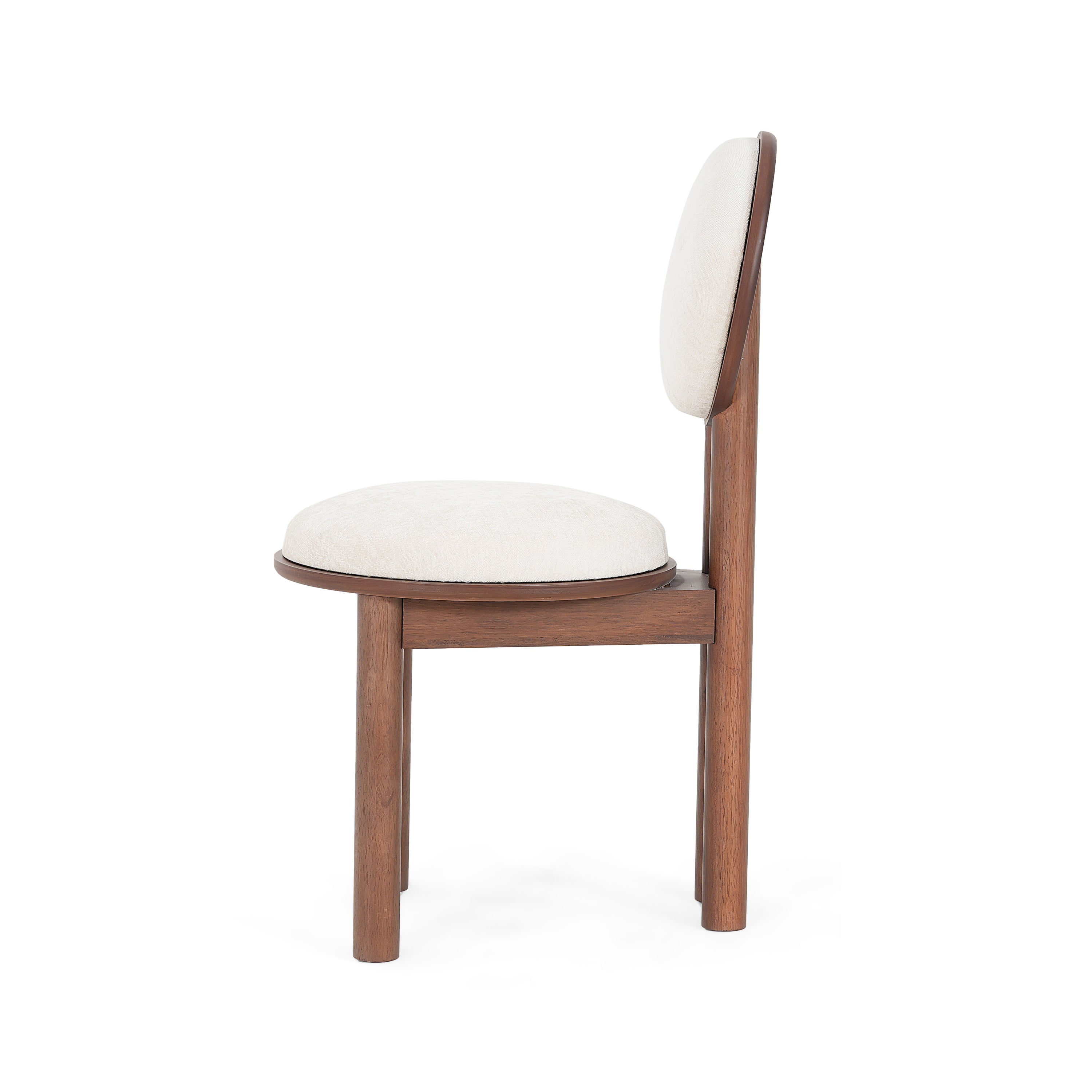 Side profile of beige fabric dining chair with wooden frame. Displays ergonomic seat depth and cushioned support.