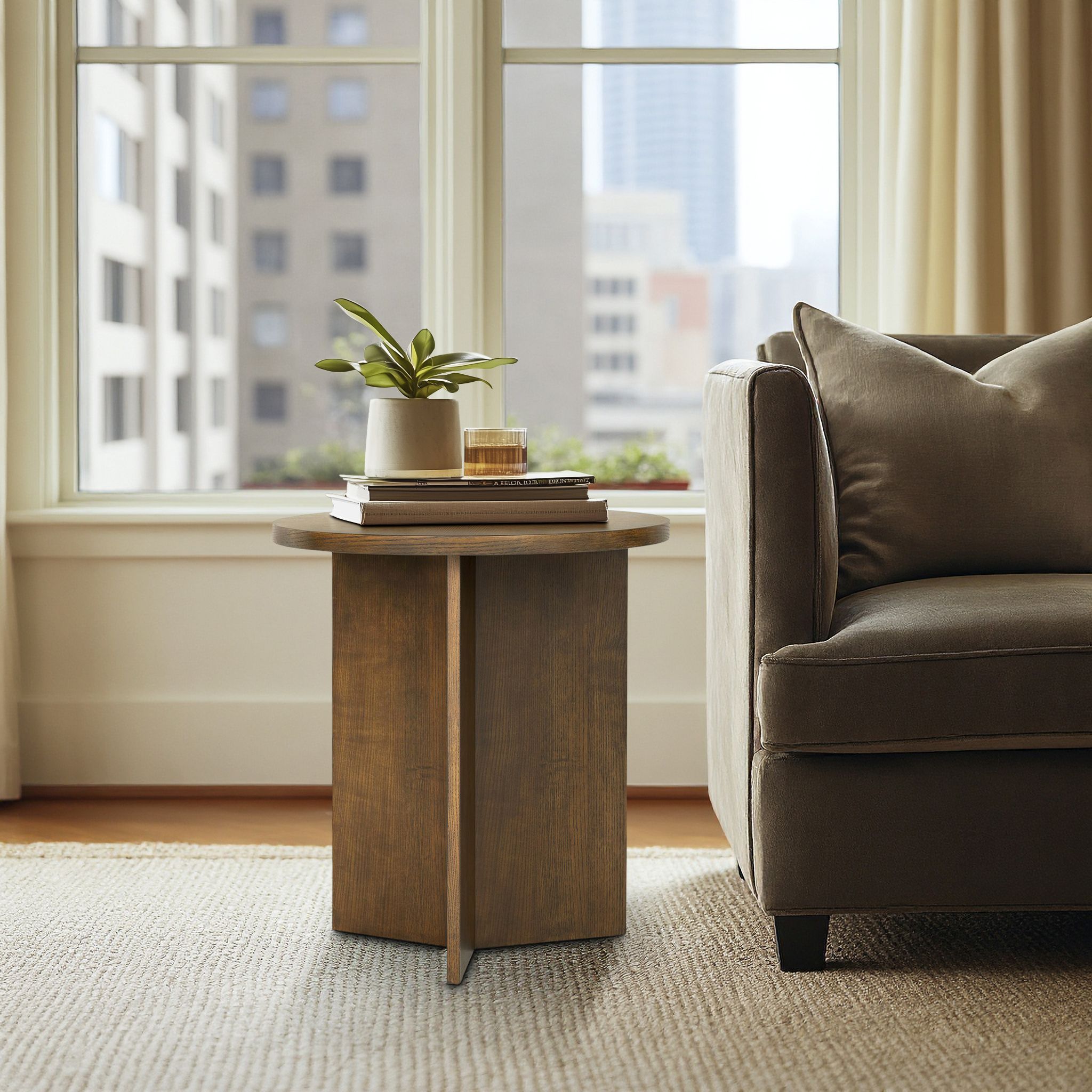 Sadie Walnut Brown Accent Table placed next to a gray sofa in a city apartment, perfect for compact living areas with modern decor.