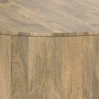 Detailed corner view of the Millbury Drum Coffee Table - Wood, showcasing its seamless drum design and high-quality wood craftsmanship.