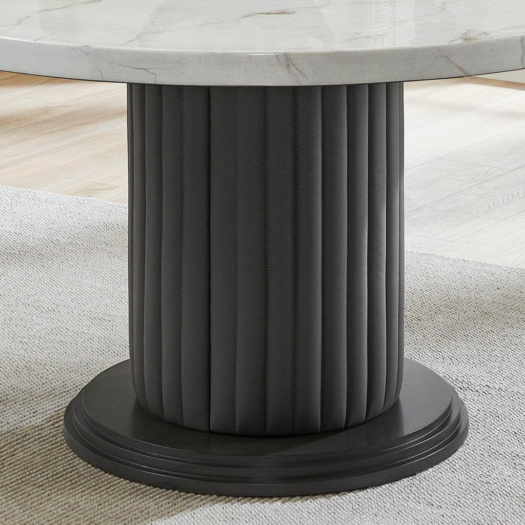Close-up of the Valencia Dining Set's fluted black pedestal base, adding a bold and elegant touch to the round marble table.