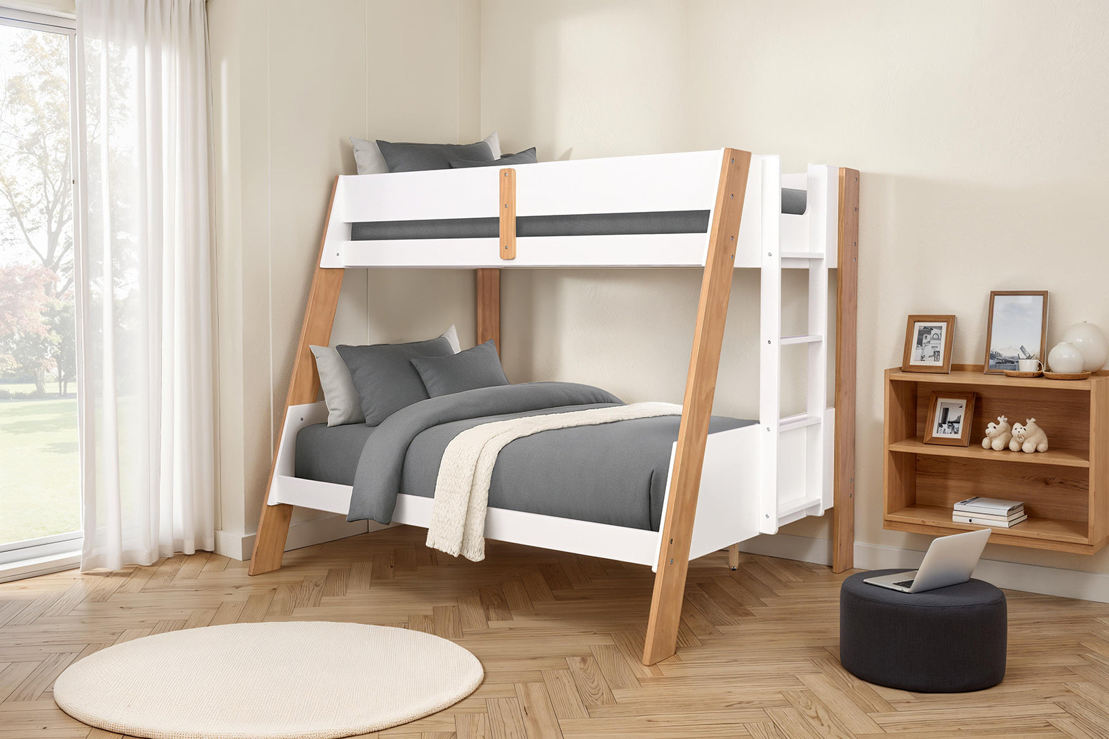 Twin over full bunk bed with ladder and natural finish in a bright bedroom, styled with gray bedding and wood decor.