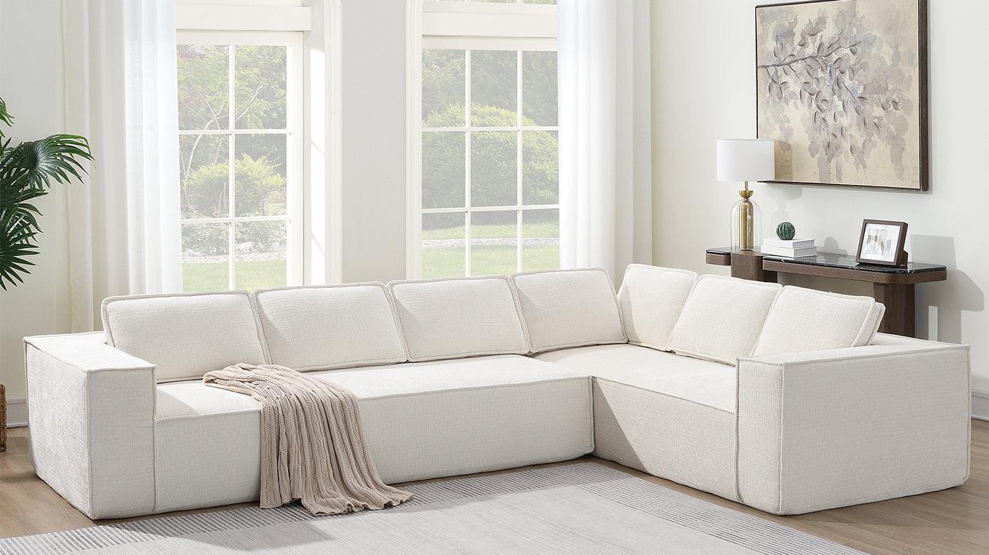 Minimalist chenille modular sectional sofa in modern living space, arranged with throw blanket and natural light from windows.