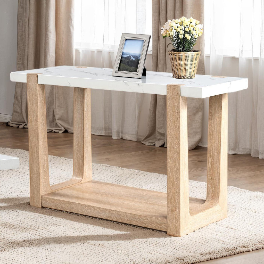 Modern faux marble top sofa table with natural wood legs, placed in a sunlit room with minimalist decor.