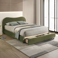 Olive Green Velvet Queen Bed with Storage in modern bedroom. Features curved headboard and pull-out drawer for hidden storage.