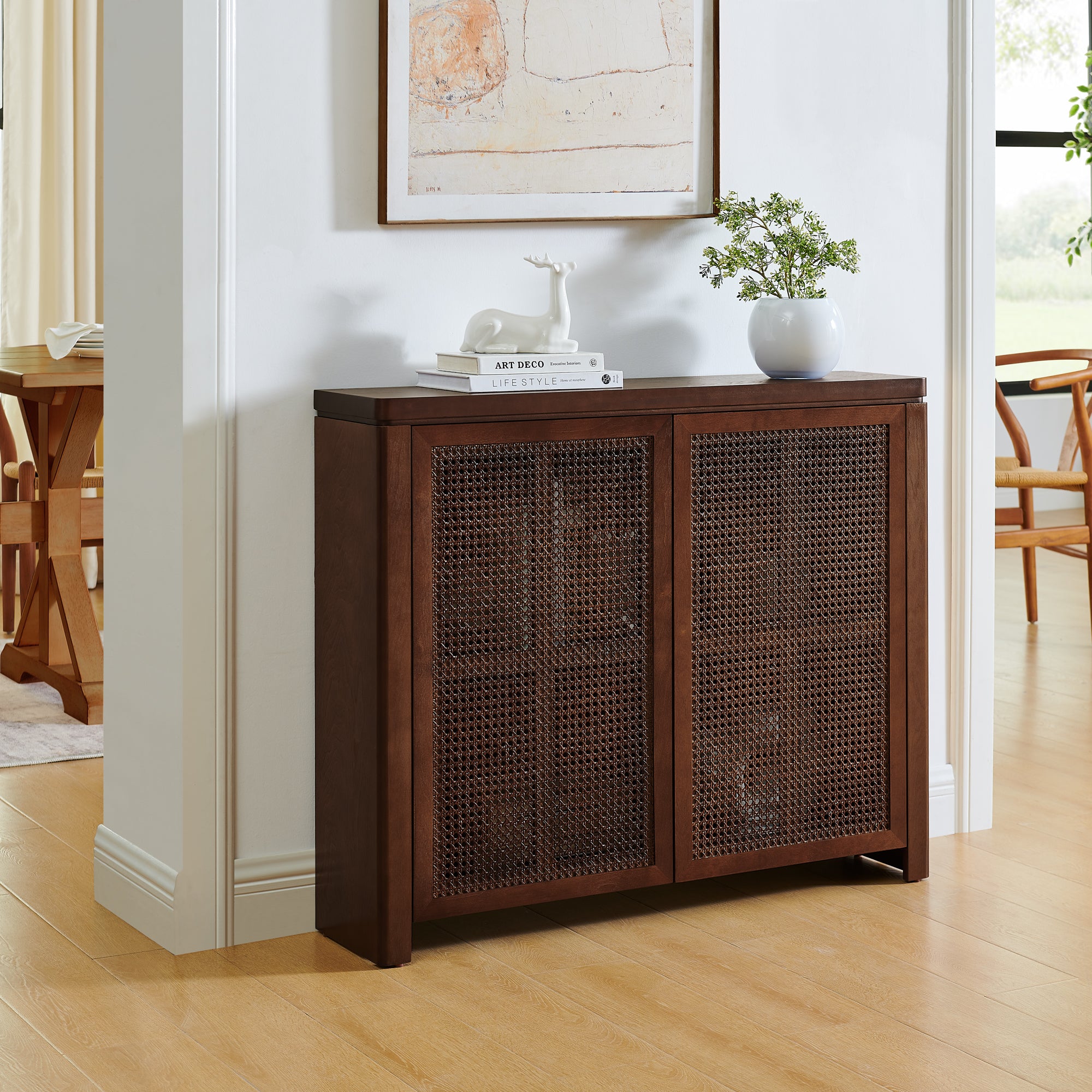 Mid Century Rattan Sideboard Cabinet with Storage in walnut finish placed in entryway, featuring natural rattan doors and smooth curved edges.