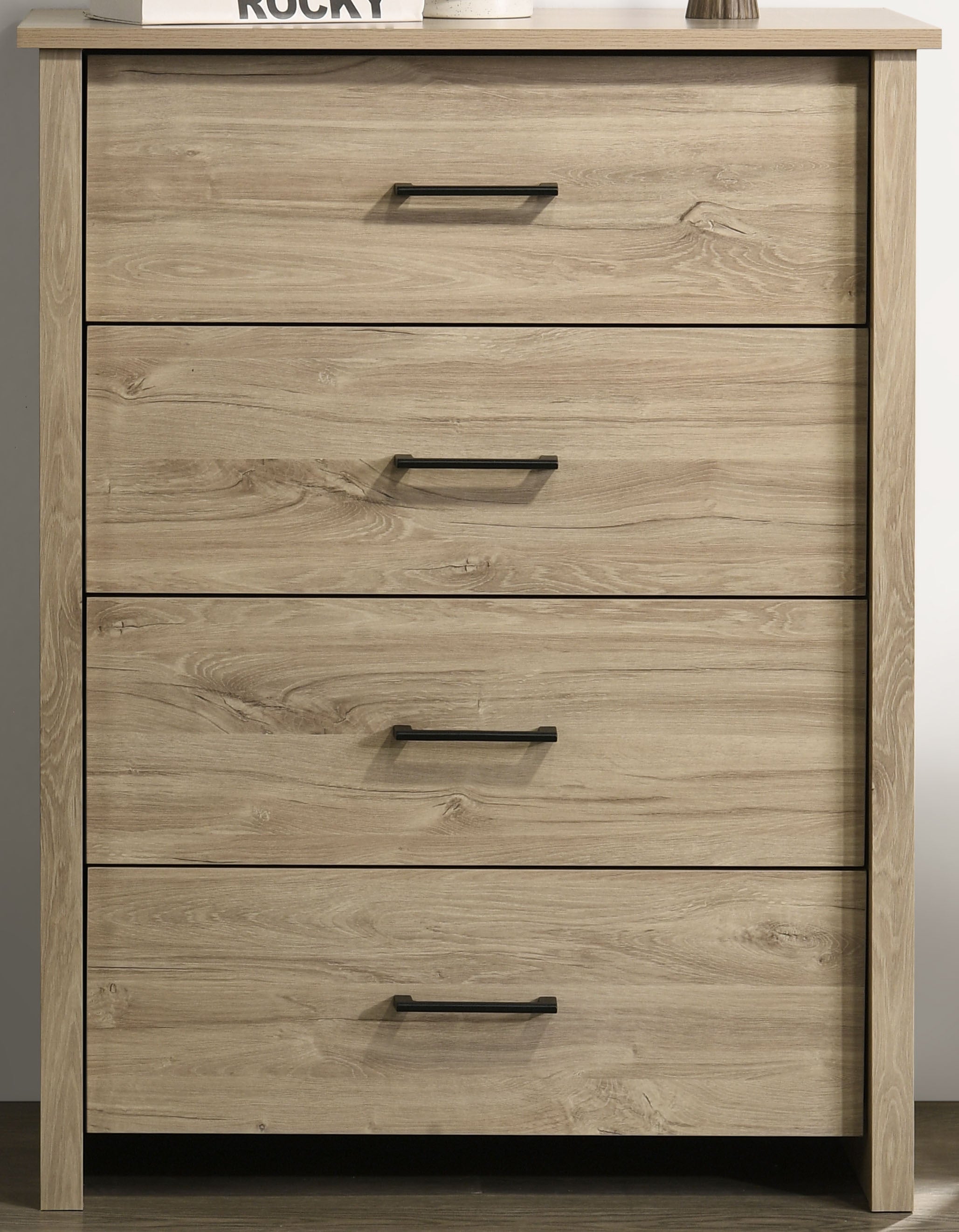 Close-up of Light Oak 4-Drawer Chest - Black Handles showing wood grain texture and sleek drawer alignment for practical storage.