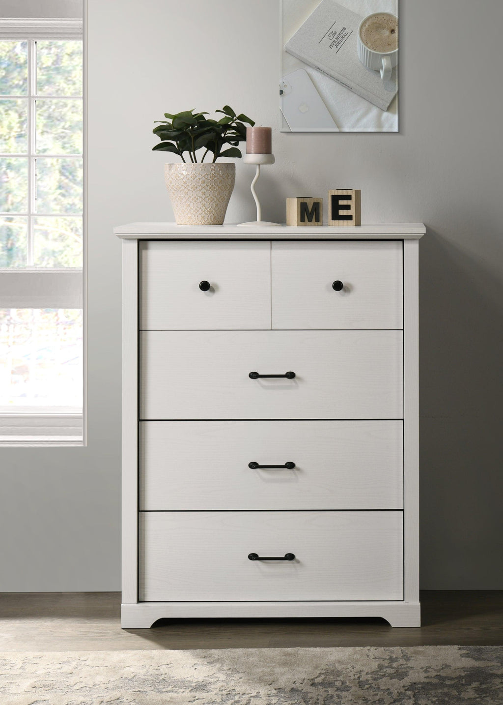Elara White 4-Drawer Chest with Black Metal Handles.
