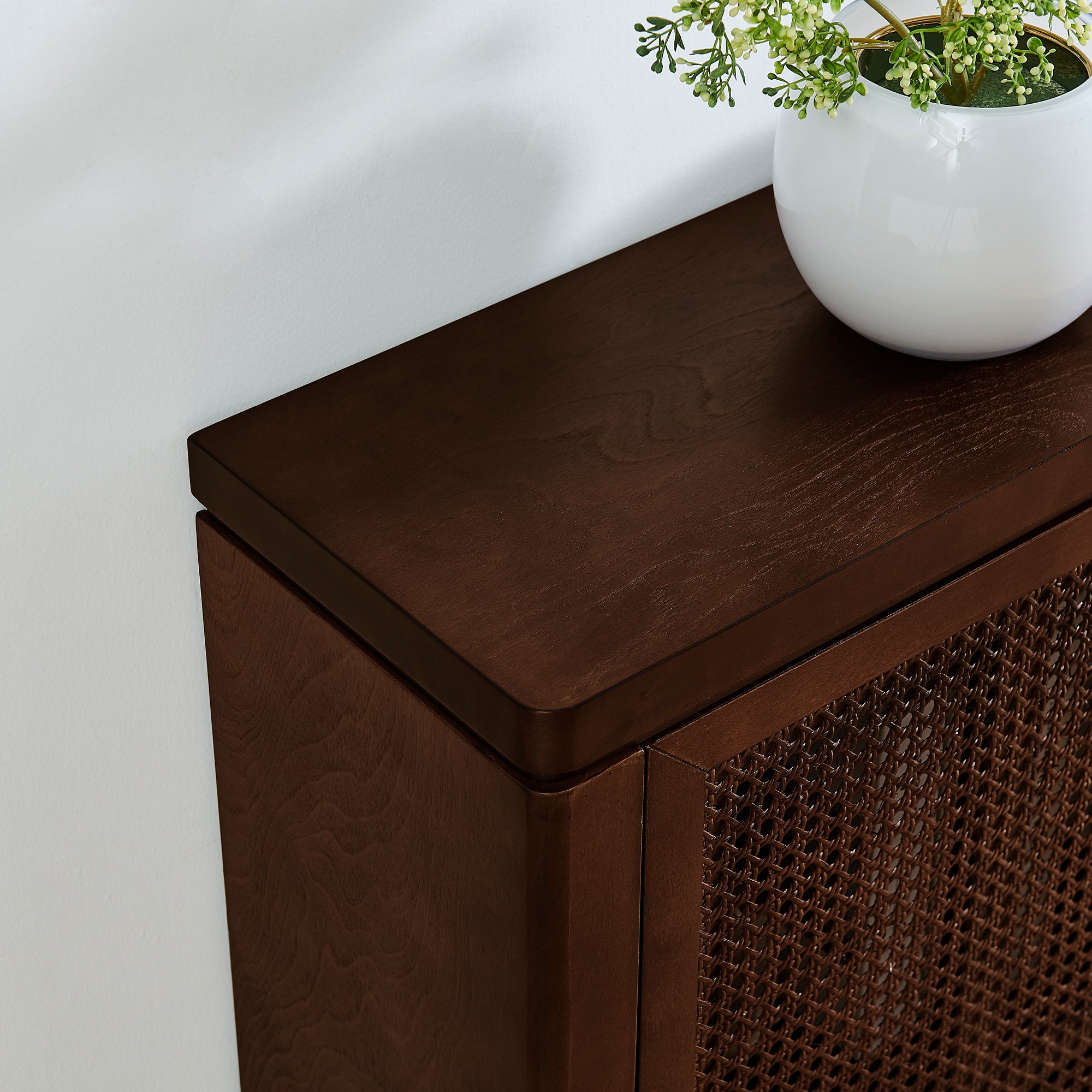 Top view of walnut Mid Century Rattan Sideboard Cabinet showing smooth curved edge and wood grain texture.