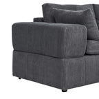 Detail of the wide armrest and cushion on the corduroy sectional. Emphasizes soft padding and ribbed fabric texture.