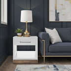 Nora End Table 22 inch in Jasmine White with drawer and shelf, styled in a dark modern living room with gold lamp and navy sofa.