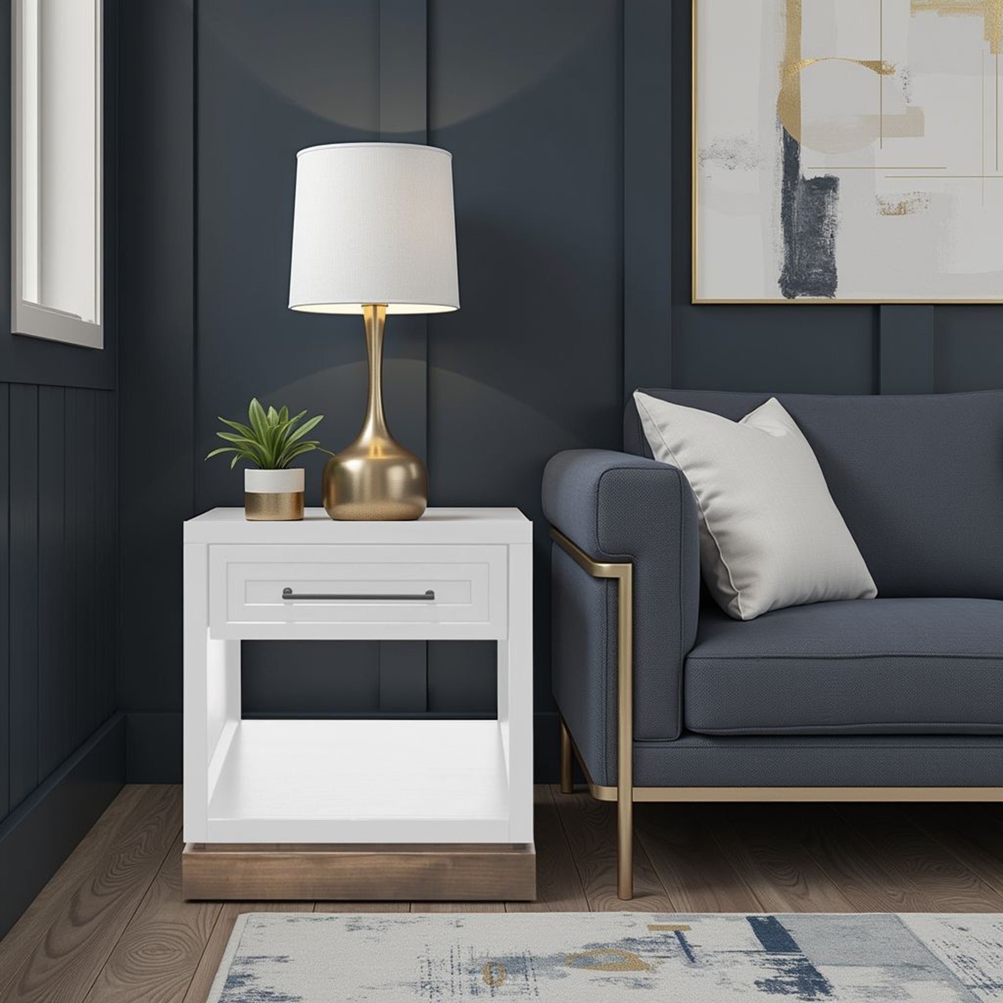 Nora End Table 22 inch in Jasmine White with drawer and shelf, styled in a dark modern living room with gold lamp and navy sofa.
