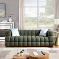 Olive Green Boucle Sofa - 3 Seater, Marshmallow Cozy design in a modern living room with large windows and light decor.