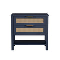 Boho navy blue nightstand with two rattan-front drawers, gold handles, and an open bottom storage shelf.