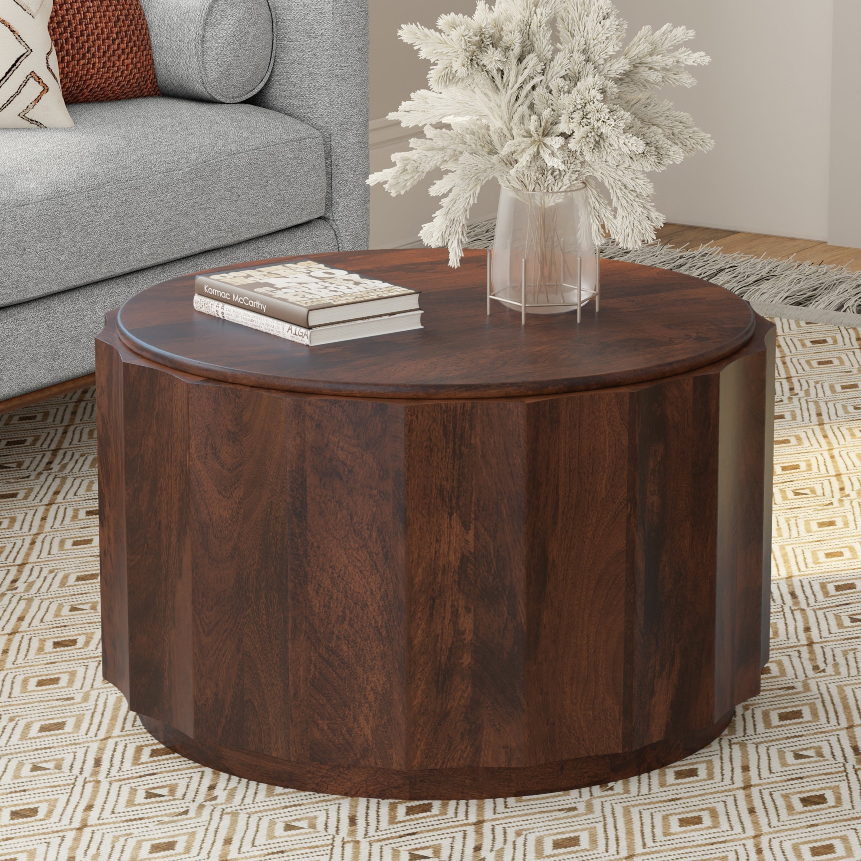Trenton Coffee Table - Walnut Brown in a living room setting with books and vase, showcasing its compact and durable mango wood design.