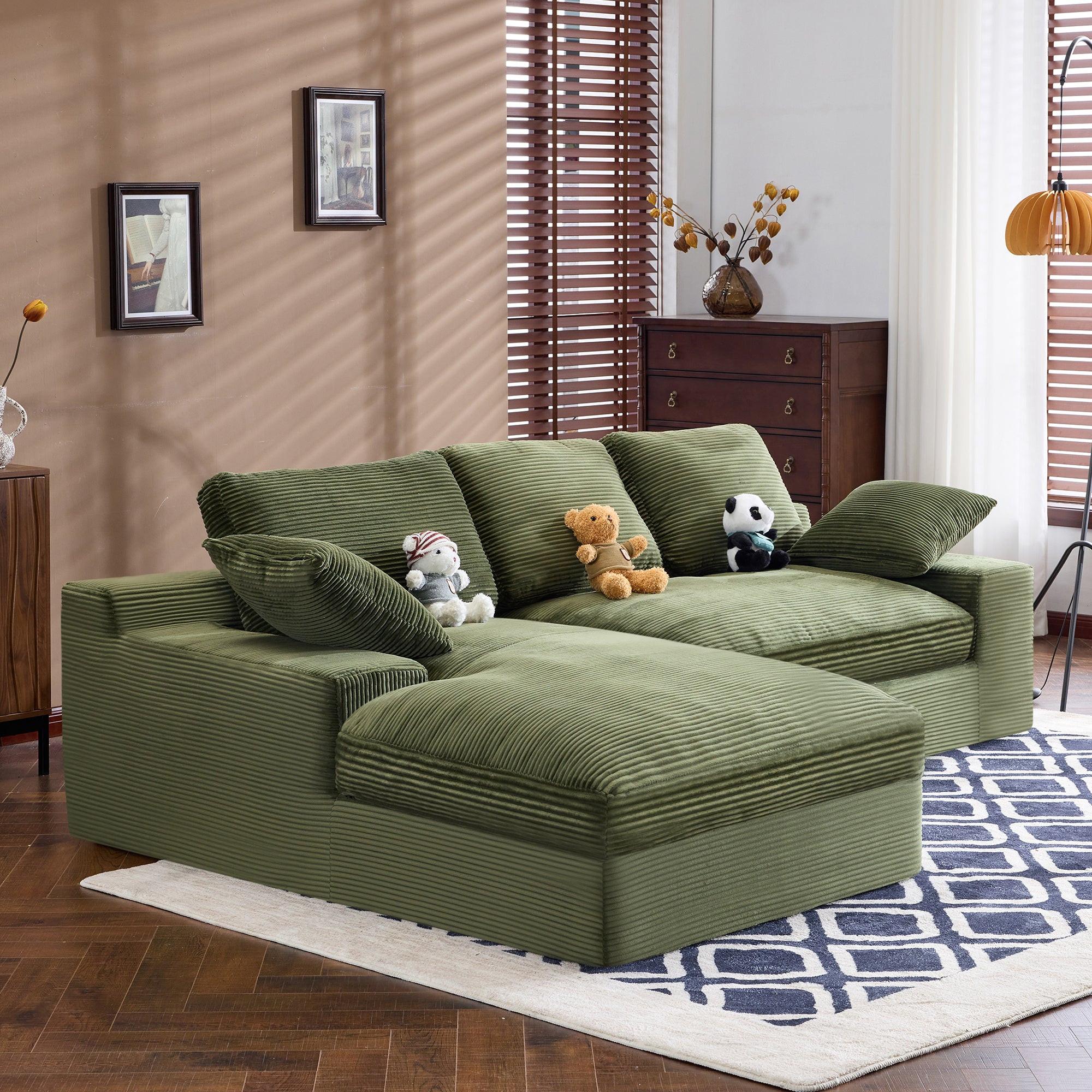 Green Corduroy Sofa with Cushions and Pillows.