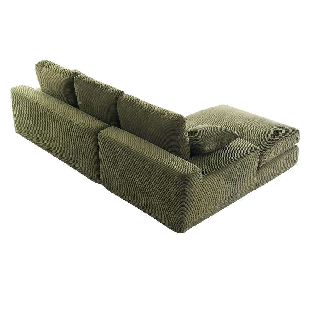 Rear angled view of green corduroy sofa with plush cushions and pillows, showcasing its compact and durable construction for home use.
