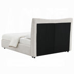 Rear view of queen size platform bed in beige chenille with black fabric paneling on the back of the headboard.