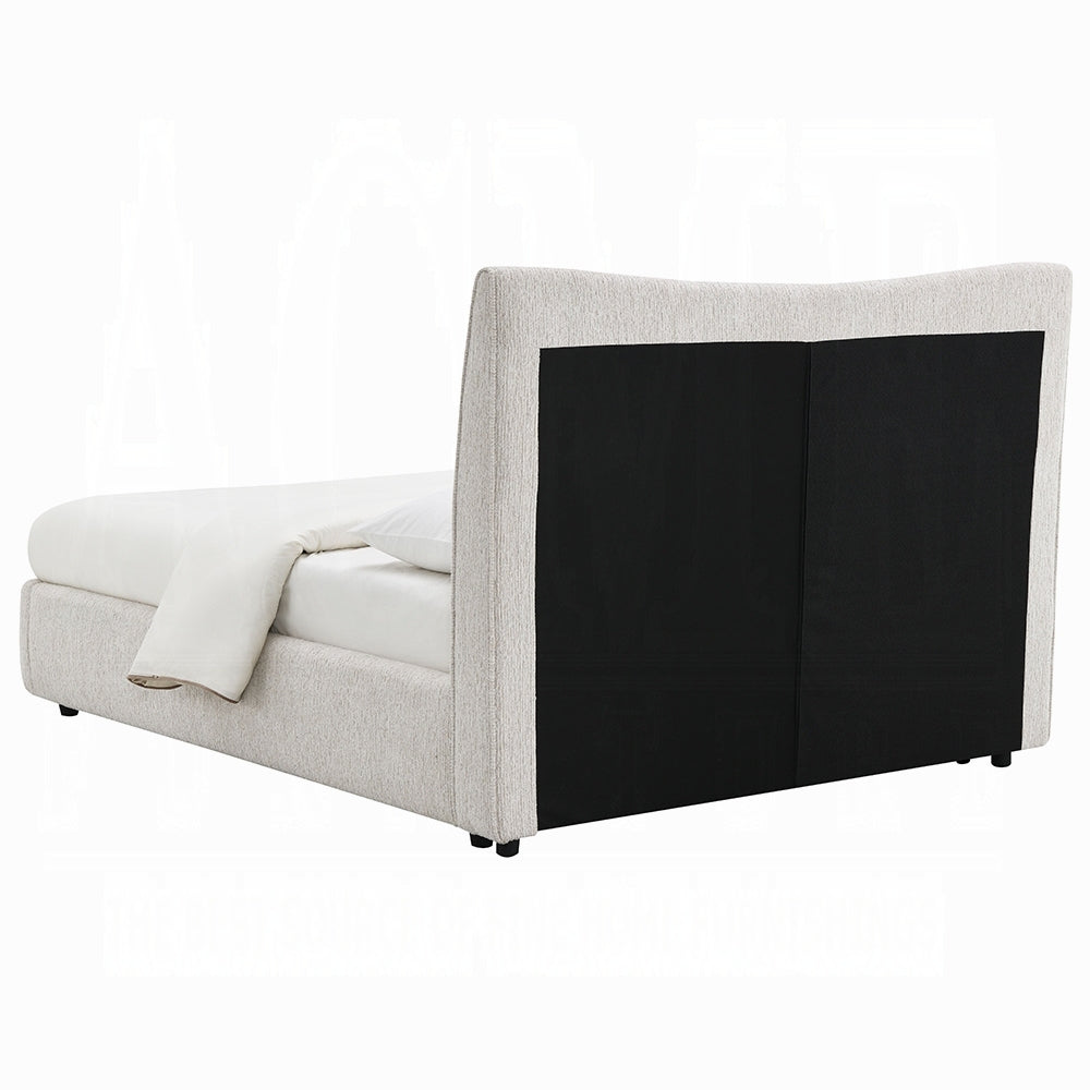 Rear view of full size beige chenille bed showcasing the black fabric panel on the back of the padded headboard.