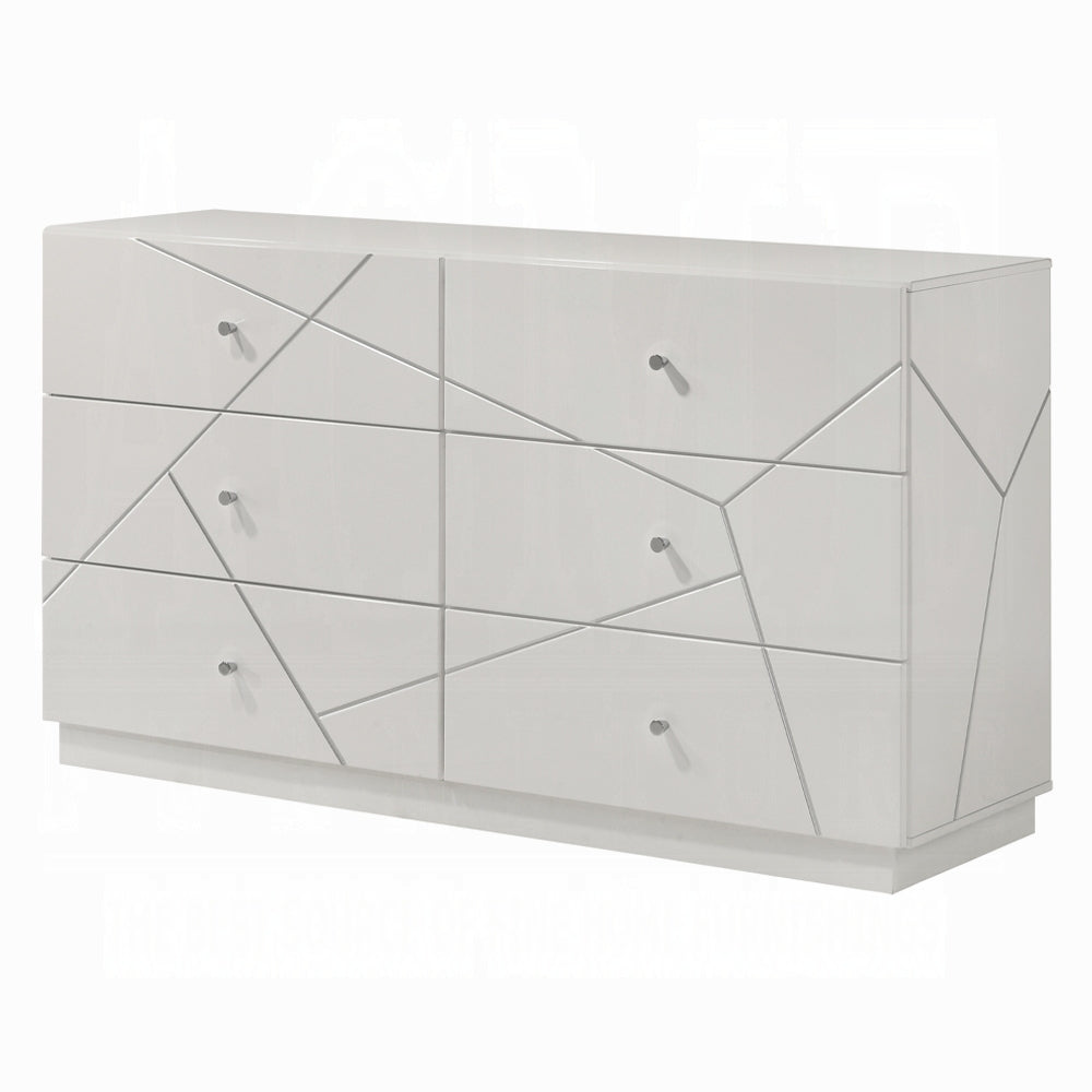 Angled side view of modern white dresser with embossed geometric lines and 6 drawers. Contemporary design with smooth white finish and metal knobs.