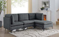 Modern charcoal grey linen modular sectional sofa with plush cushions and sleek black metal legs in a living room.