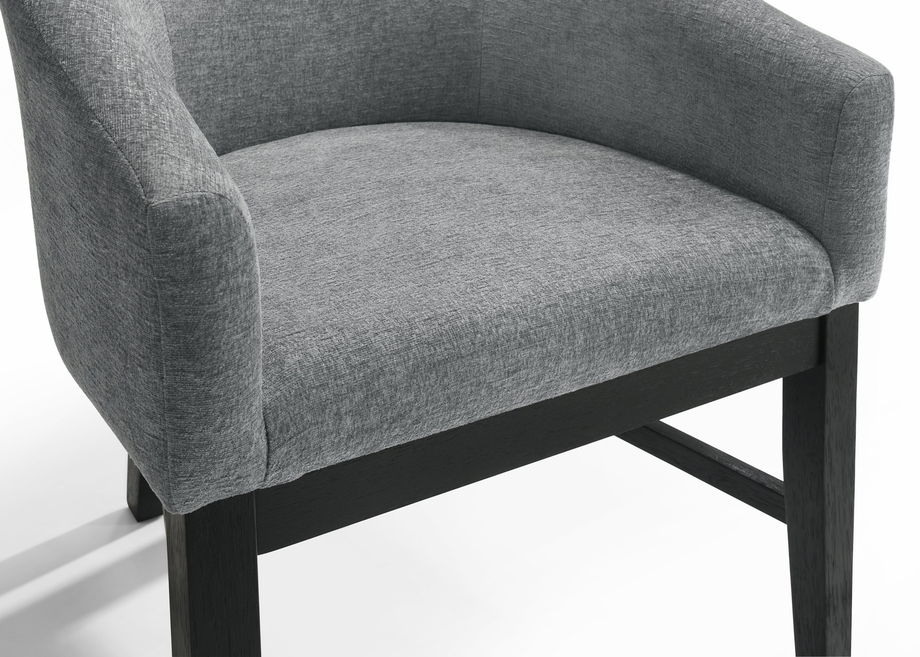 Close-up of Haven 7Pc Dining Set - Round Ebony chair seat showing textured gray upholstery and solid black wood frame for modern elegance.