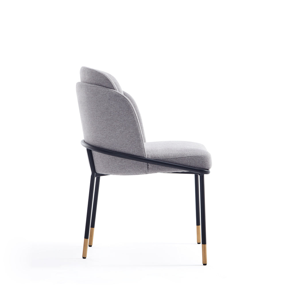 Side profile of Modern Grey Dining Chair with Metal Base showing curved backrest and sleek black legs with gold accents for a chic look.