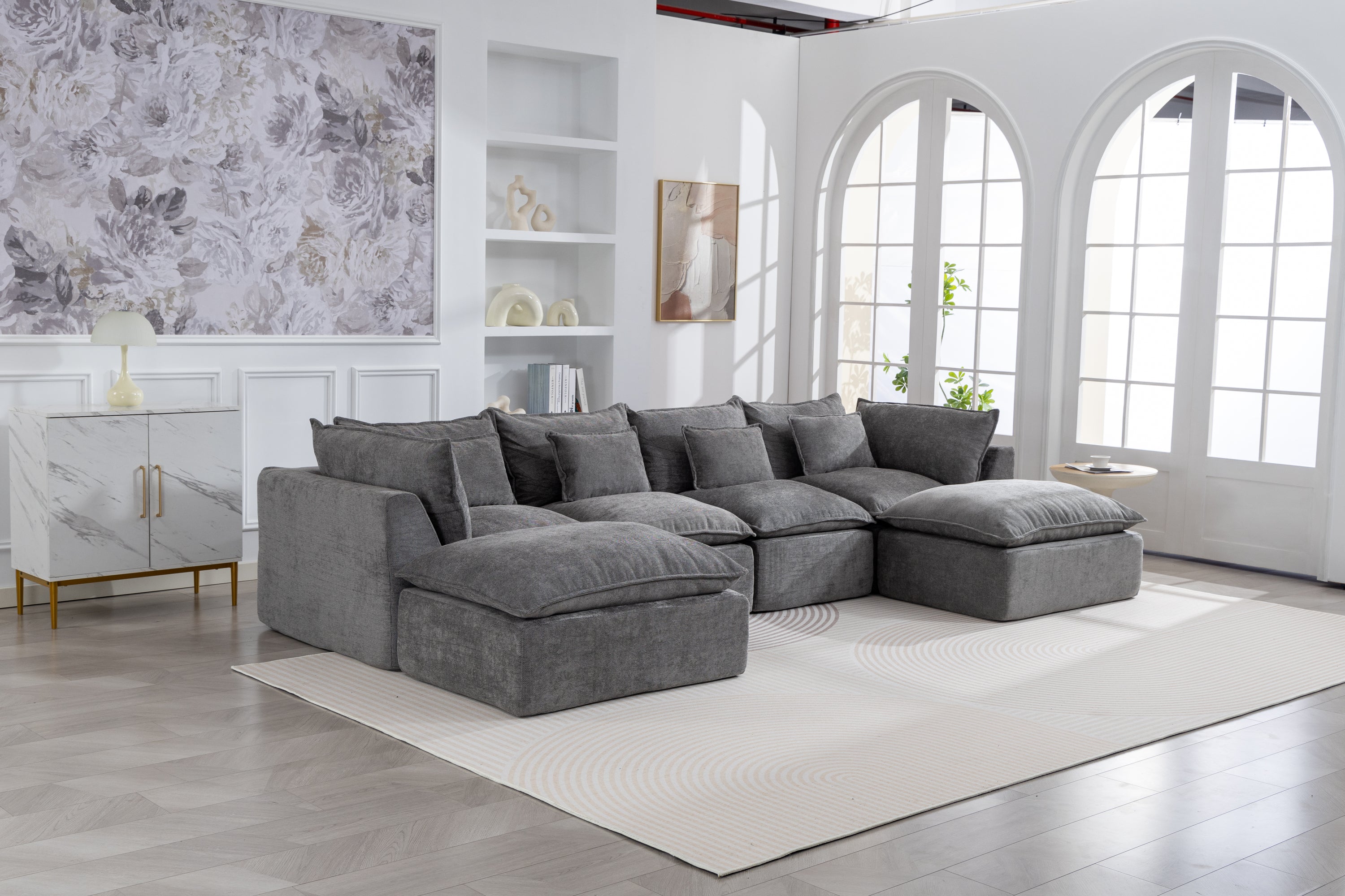 Oversized modular sectional sofa in antique grey velvet with cloud-like cushions in a bright living room. True Relax Comfy 4-seat couch setup.