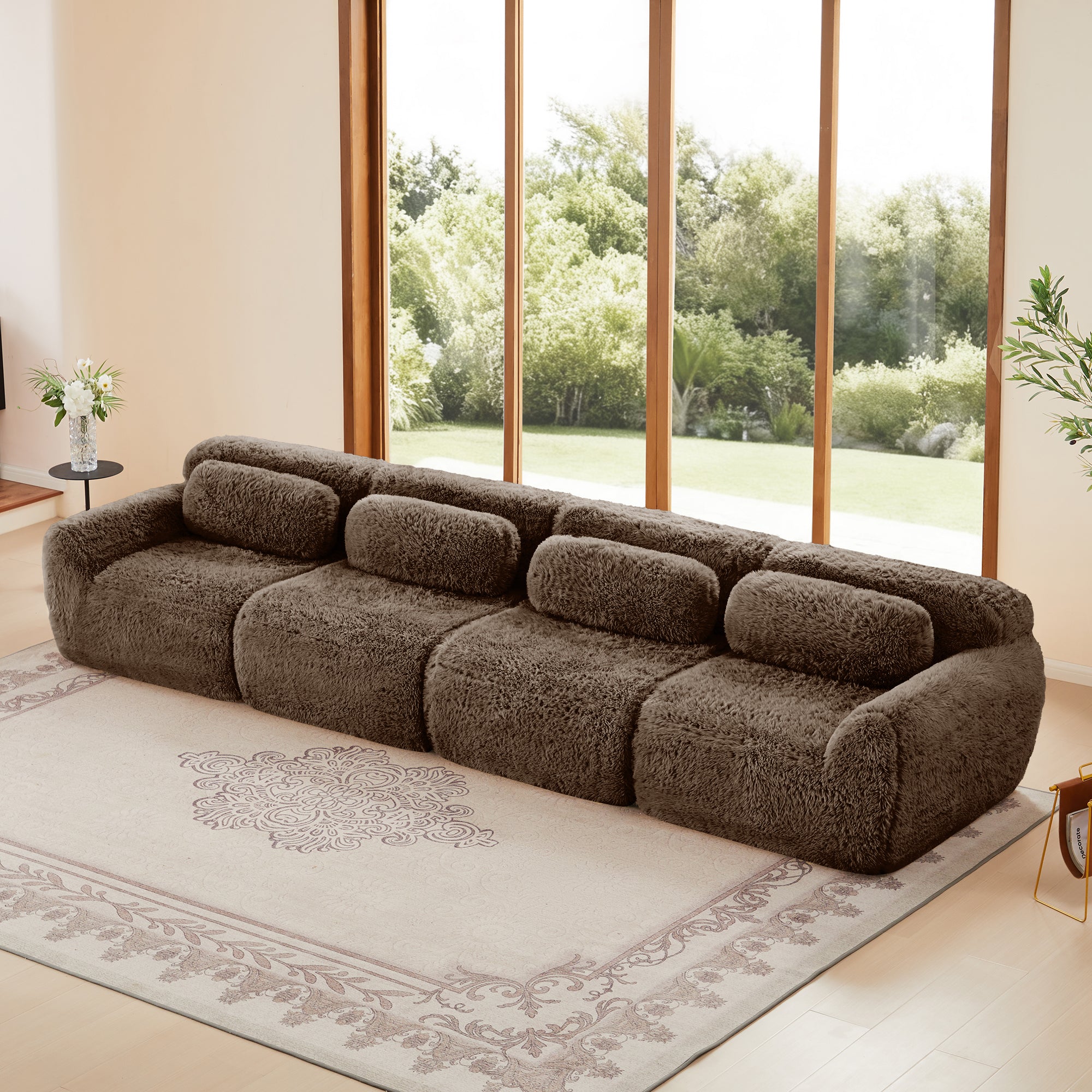 Modular chocolate plush sofa with 4 seats in a bright living room, featuring no-leg design and soft, non-slip base for versatile comfort.