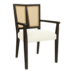 Angled view of Mid Century Dining Chair with Rattan Back, emphasizing its sleek dark wood frame and modern silhouette.
