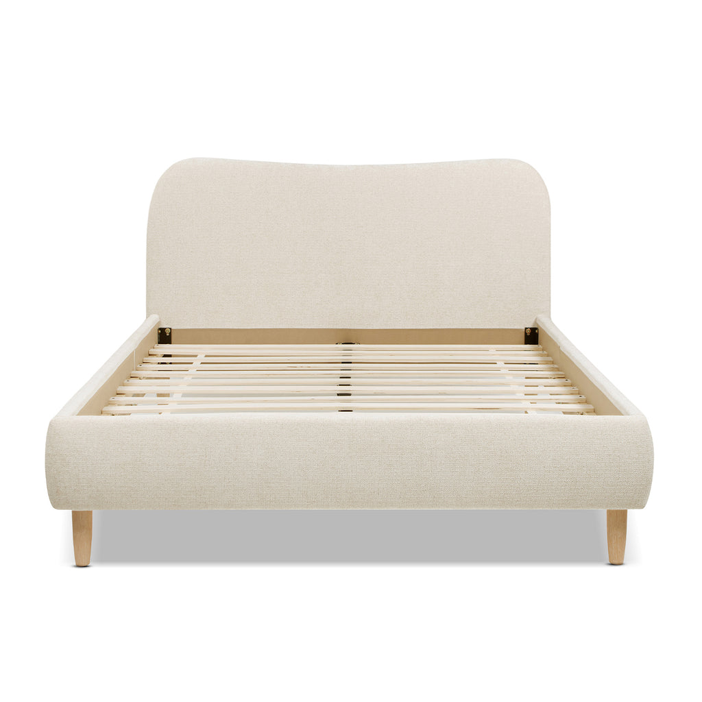 Front view of Beige Upholstered Platform Bed with Curved Headboard highlighting its smooth contours and supportive slat system for mattress stability.