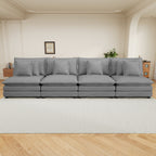 Dark grey corduroy modular sofa styled in a modern living room, showcasing its spacious, cozy design with included cushions.